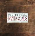 Saw mommy kissing Santa Claus Sign